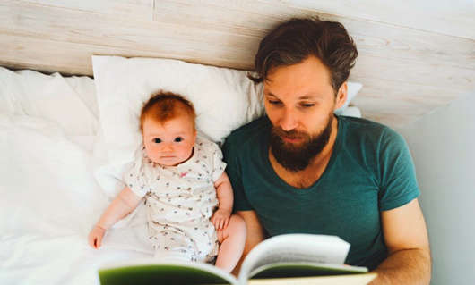 1612342454293046.jpg father-reading-book-to-baby-daughter.jpg